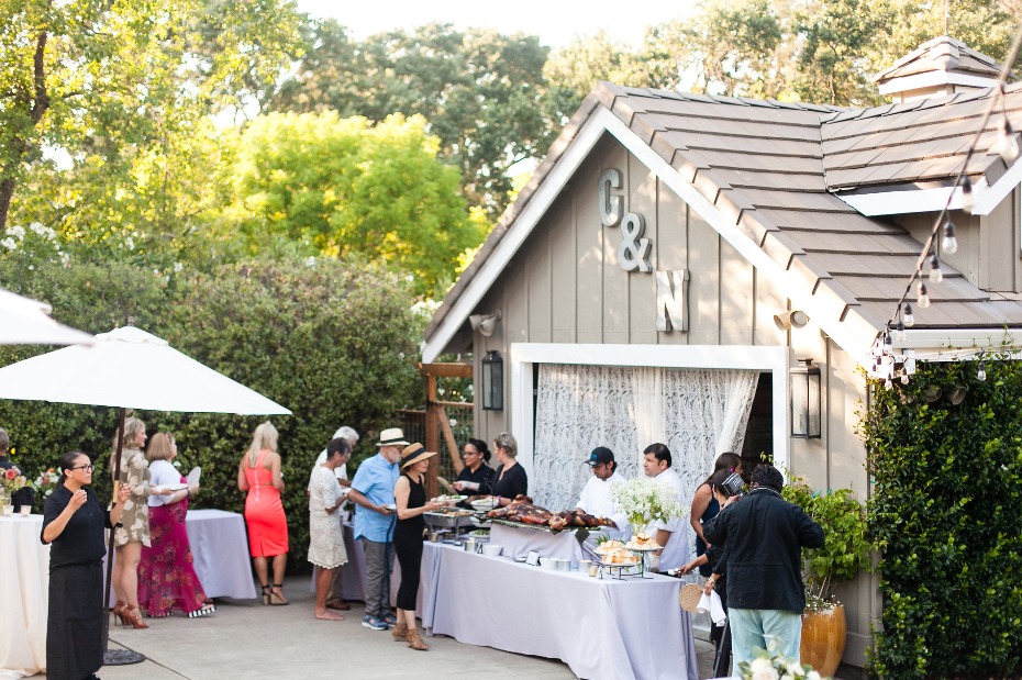 Outdoor catered party with buffet and charming building
