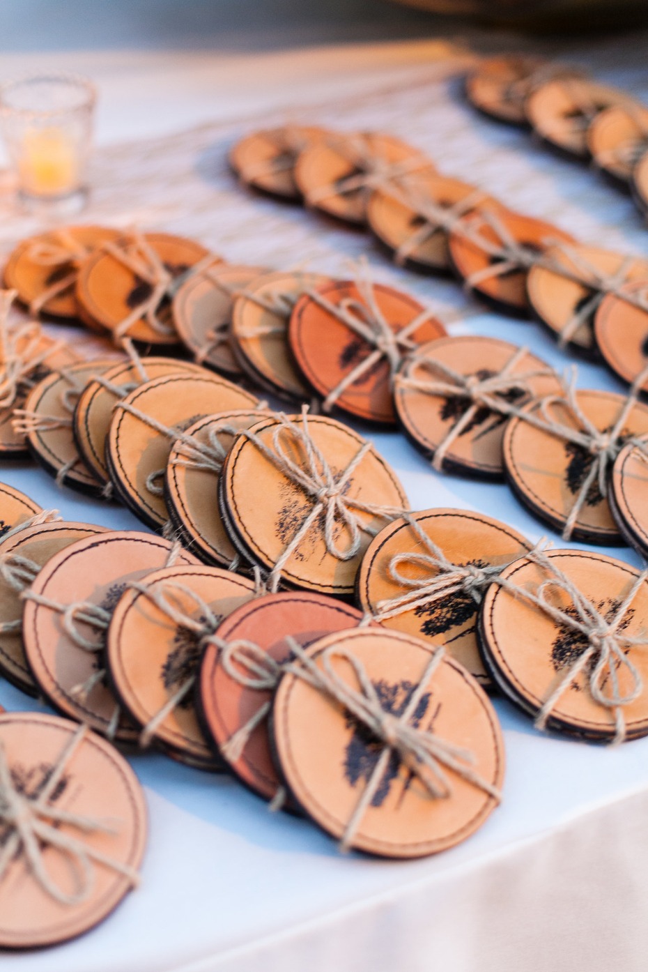 Handmade leather coasters with tree design and twine