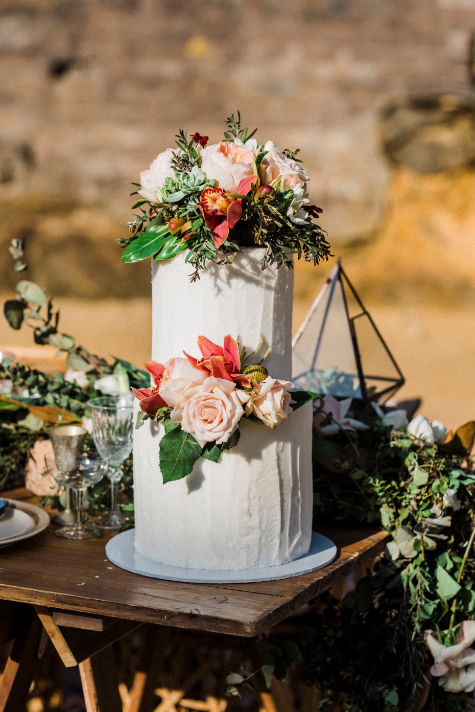 White wedding cake and florals