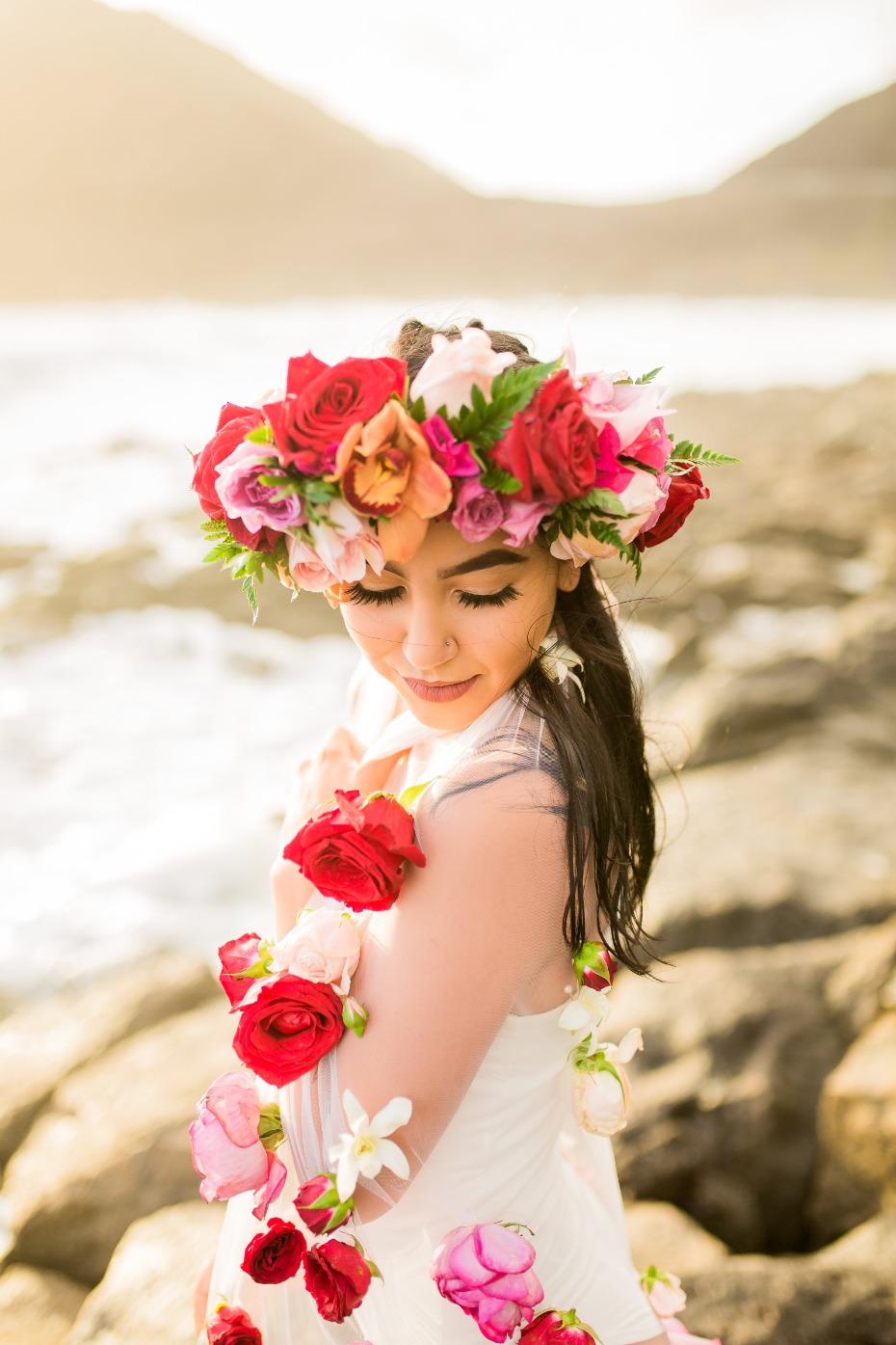 Woman with flowers in a crown and roses on her dress