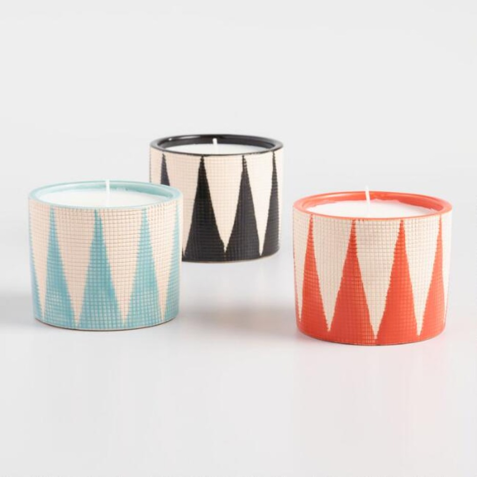 Three patterned candles in turquoise black and orange