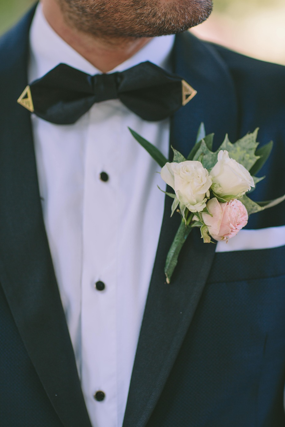 groom in navy and black wedding suit