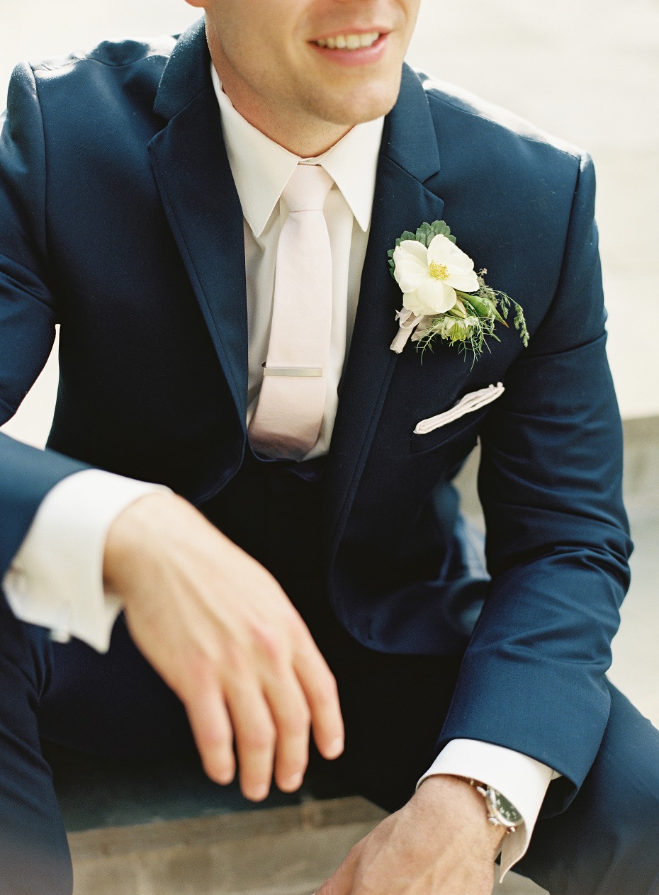 Navy suit and blush tie