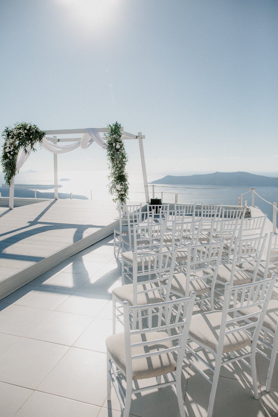White ceremony with greenery