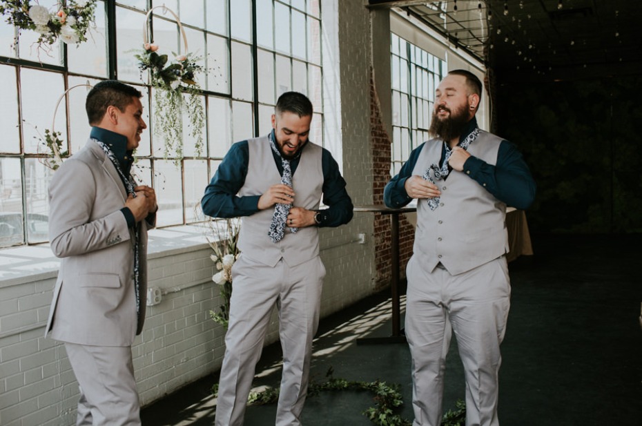 groom and his men in light grey suits