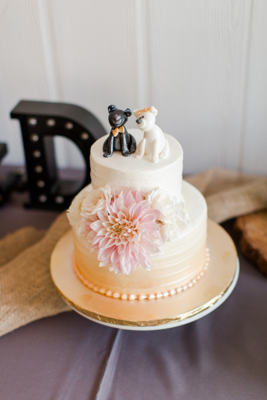 Orange ombre wedding cake with florals