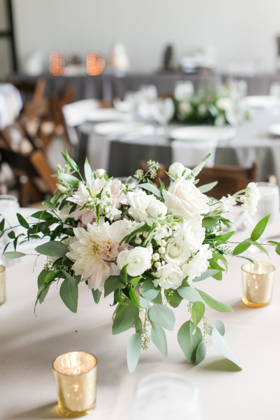 White floral centerpiece with candles
