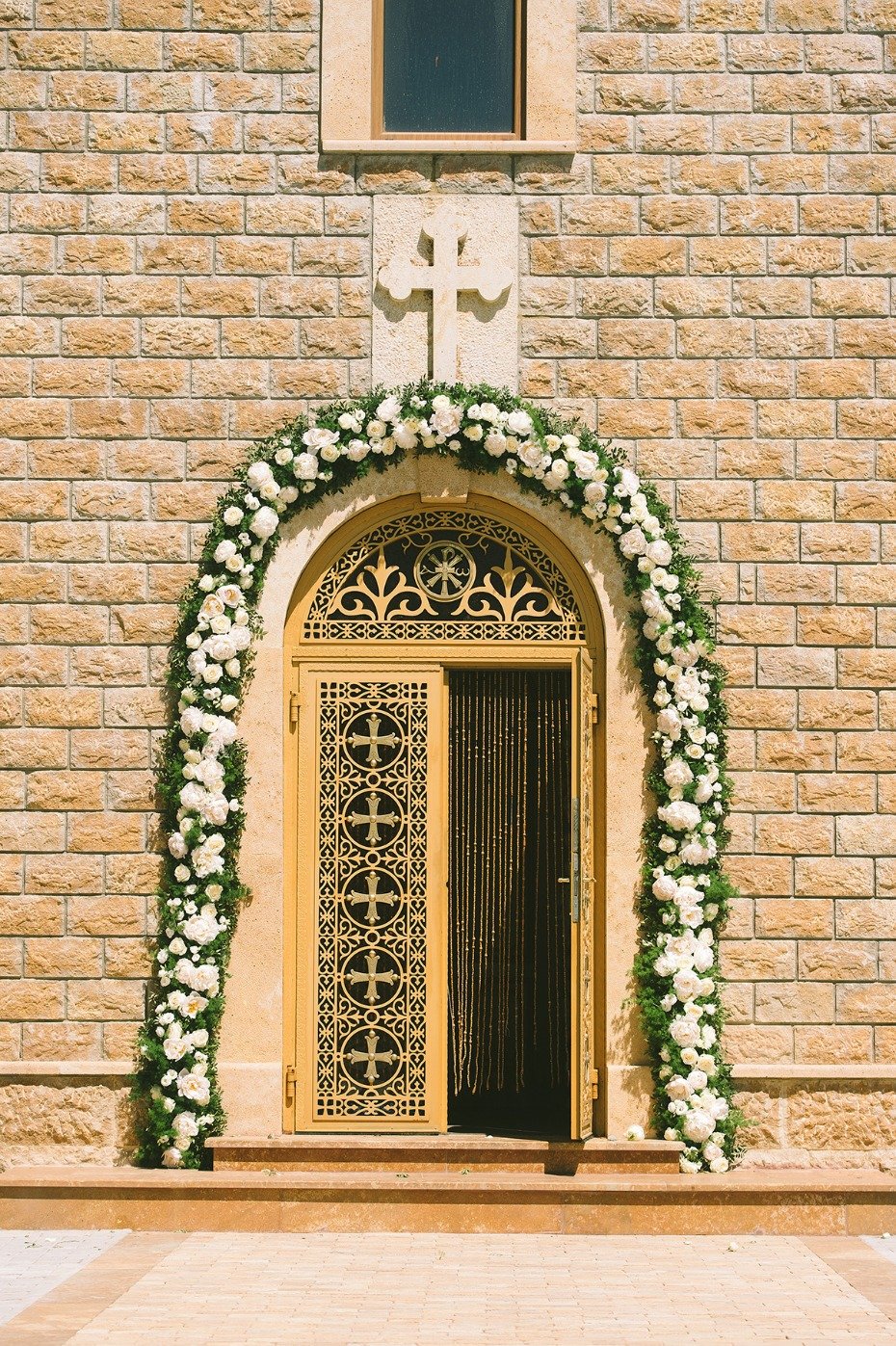 wedding church door with floral arch