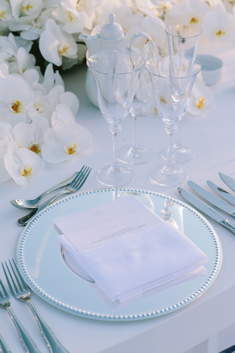 All white wedding place setting