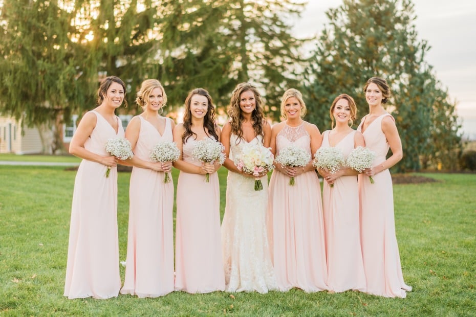 Blush bridesmaid dresses with babys breath bouquets