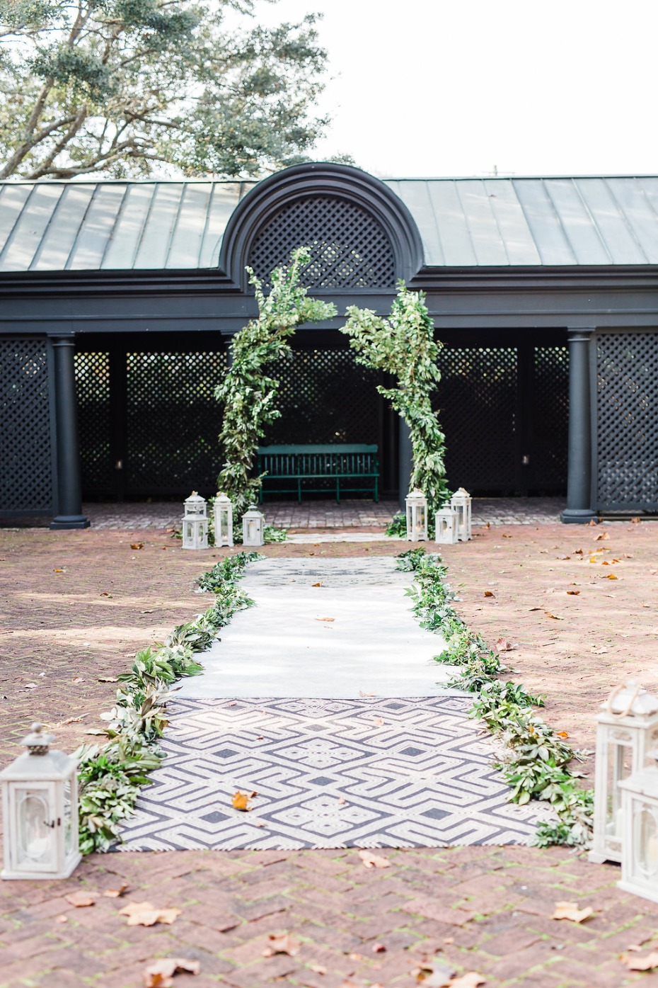 Greenery ceremony with rug aisle