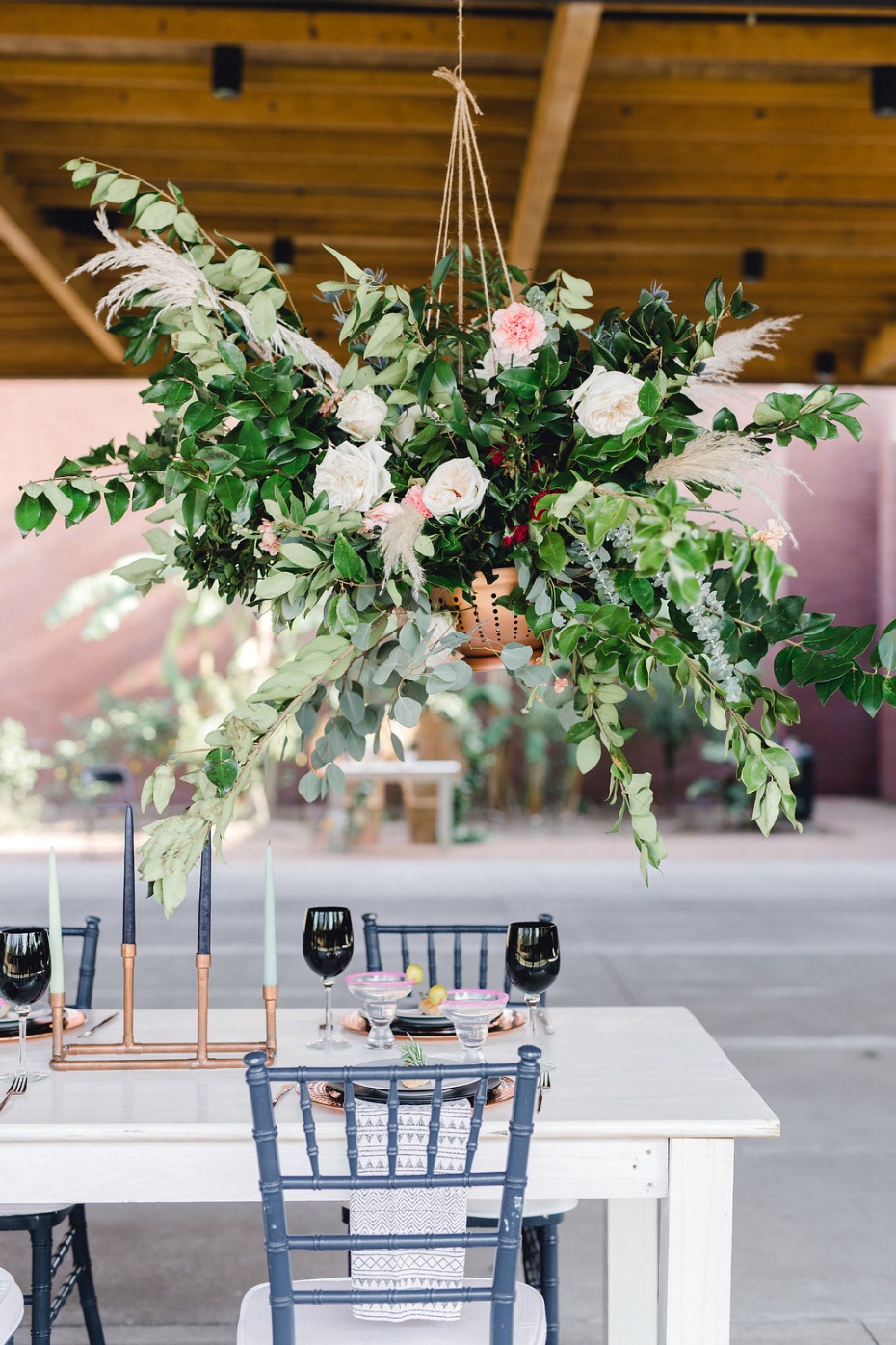 Use hanging arrangements over the reception table