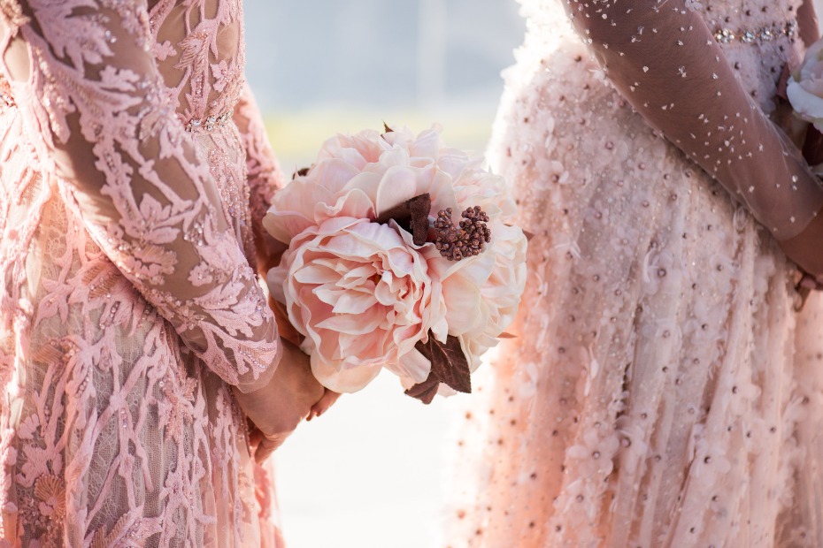 bridesmaid holding pink wedding bouquet
