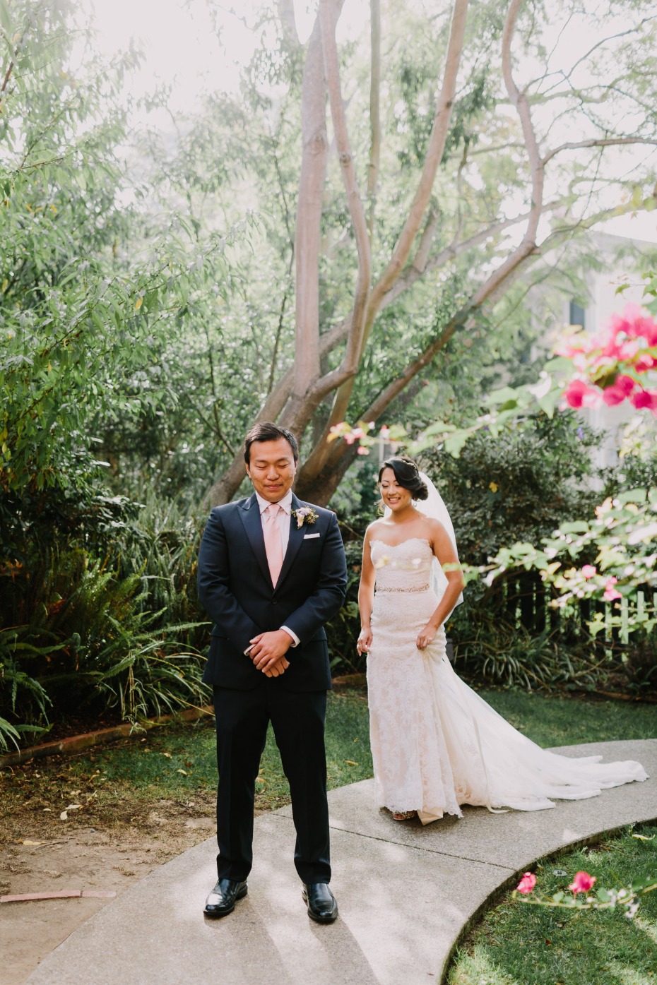 Bride approaches groom for first look wedding moment