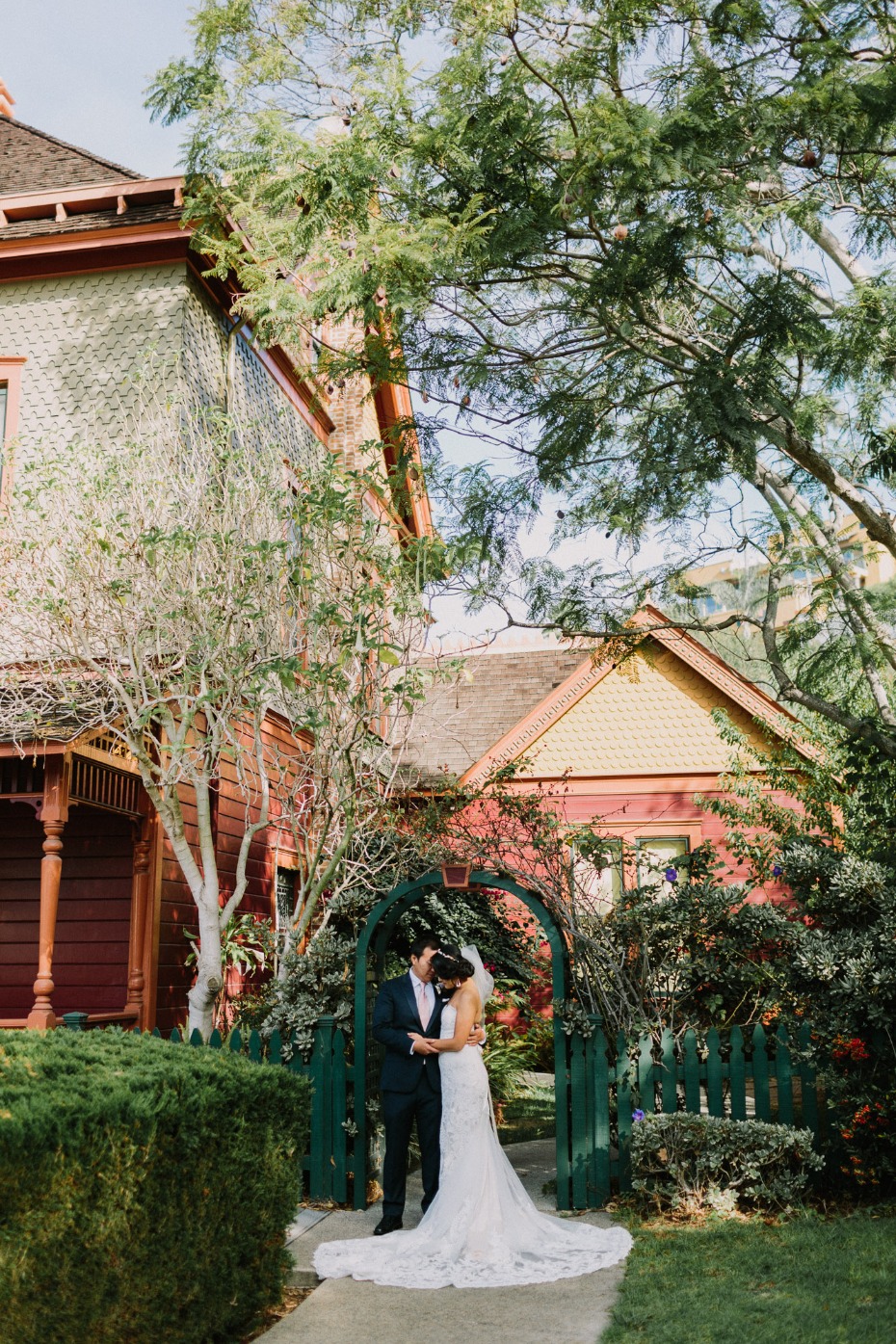 Newlyweds embrace before their historic home wedding