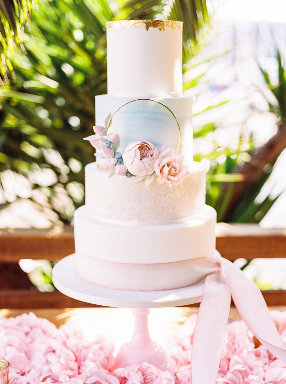 Pink, blue and gold wedding cake