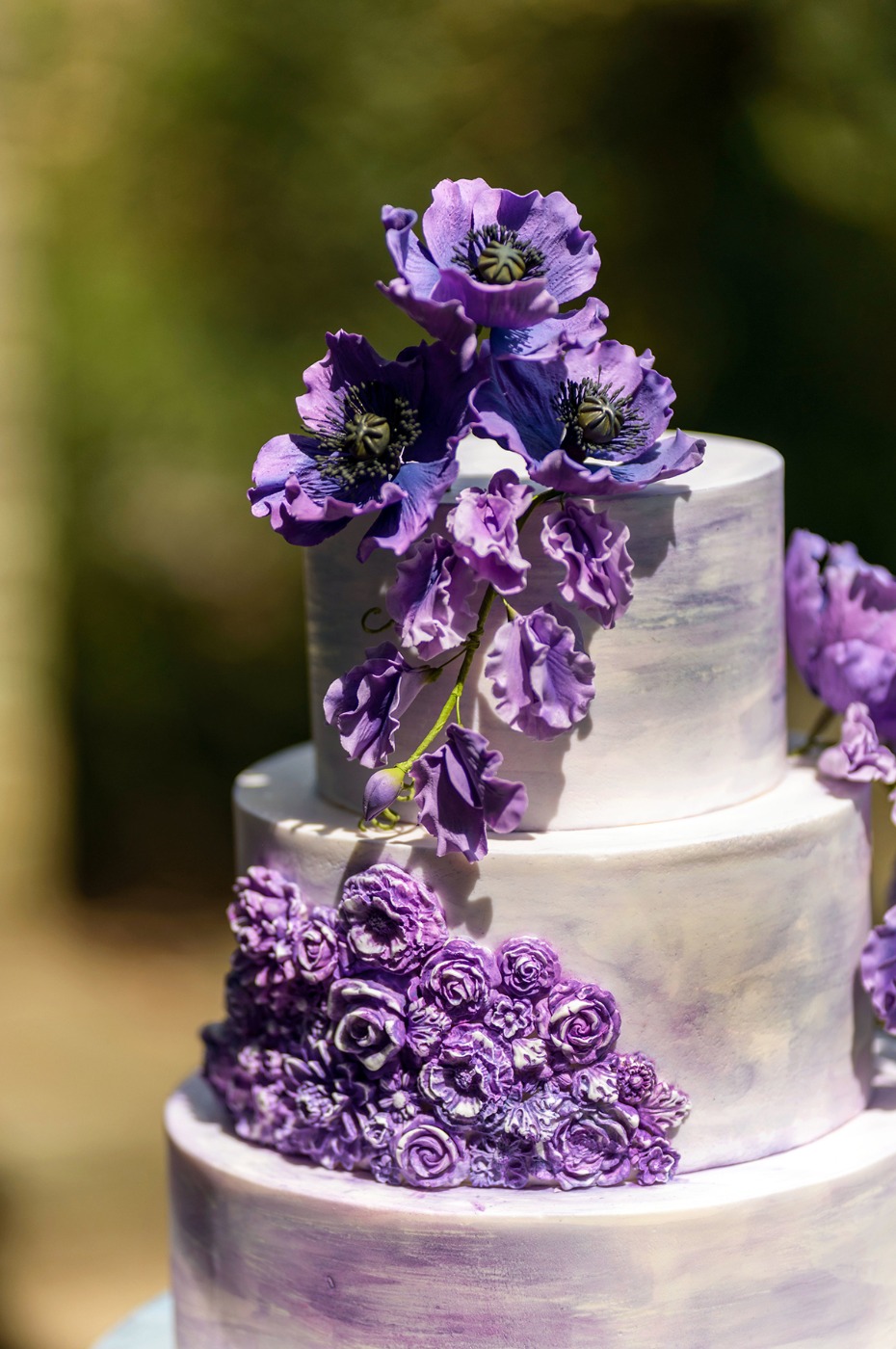 purple sugar flower topped cake