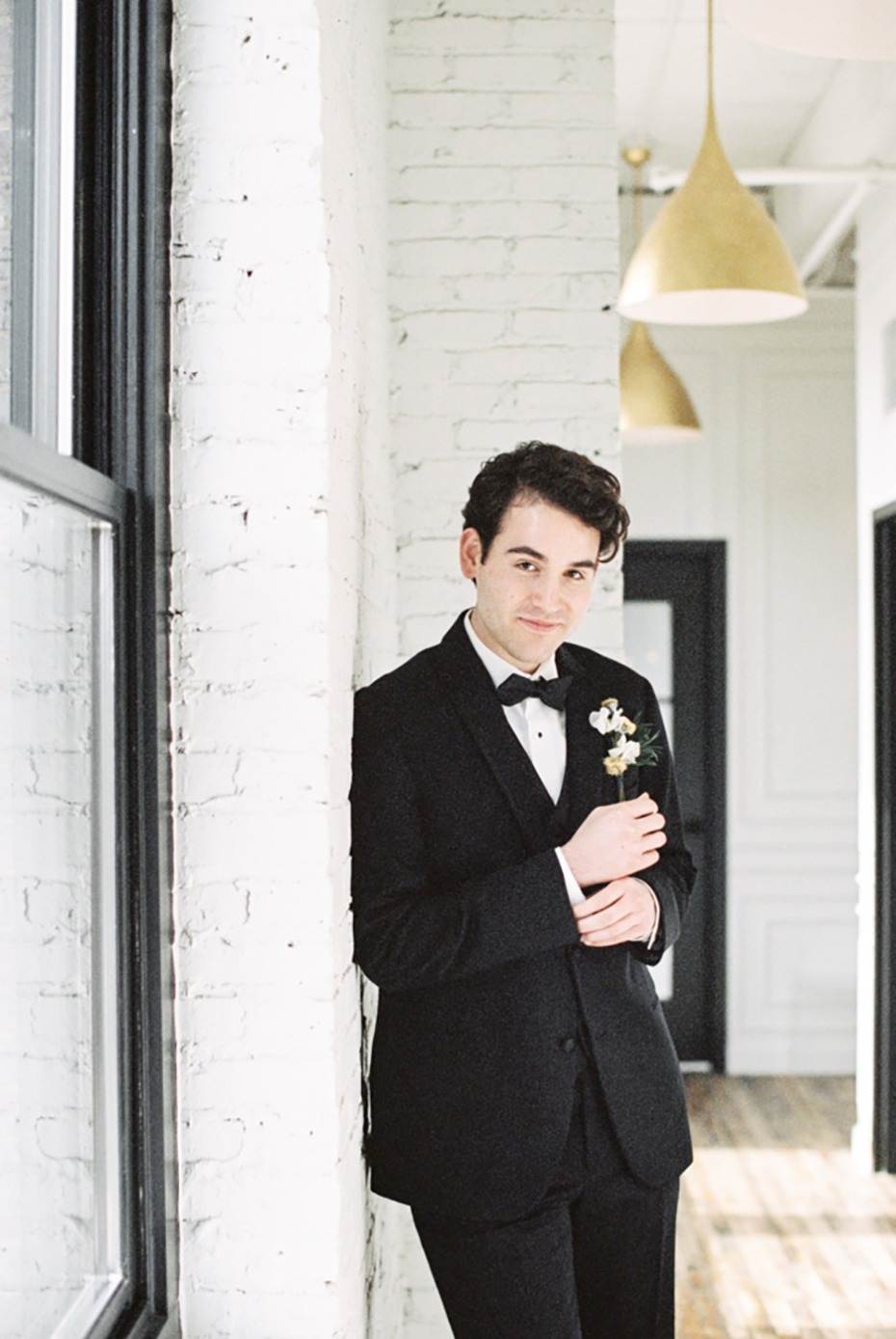 groom in black tuxedo