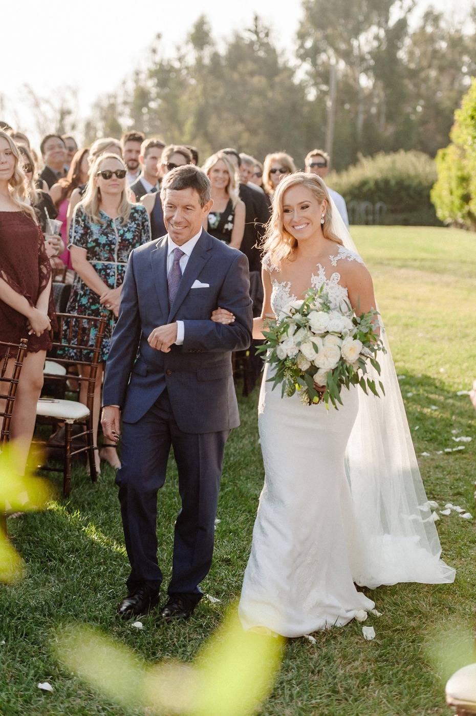 Bride walks down the aisle with her father on her wedding day