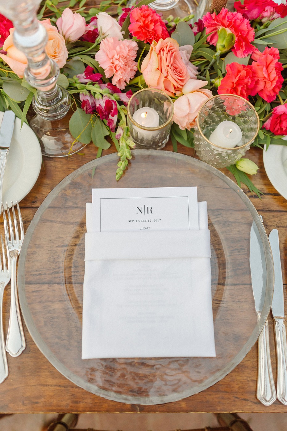Elegant wedding table setting with flowers and a personalized menu