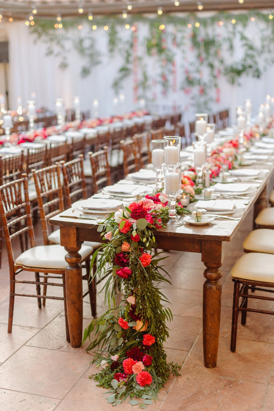 Elegant wedding reception table decorated with flowers and candles