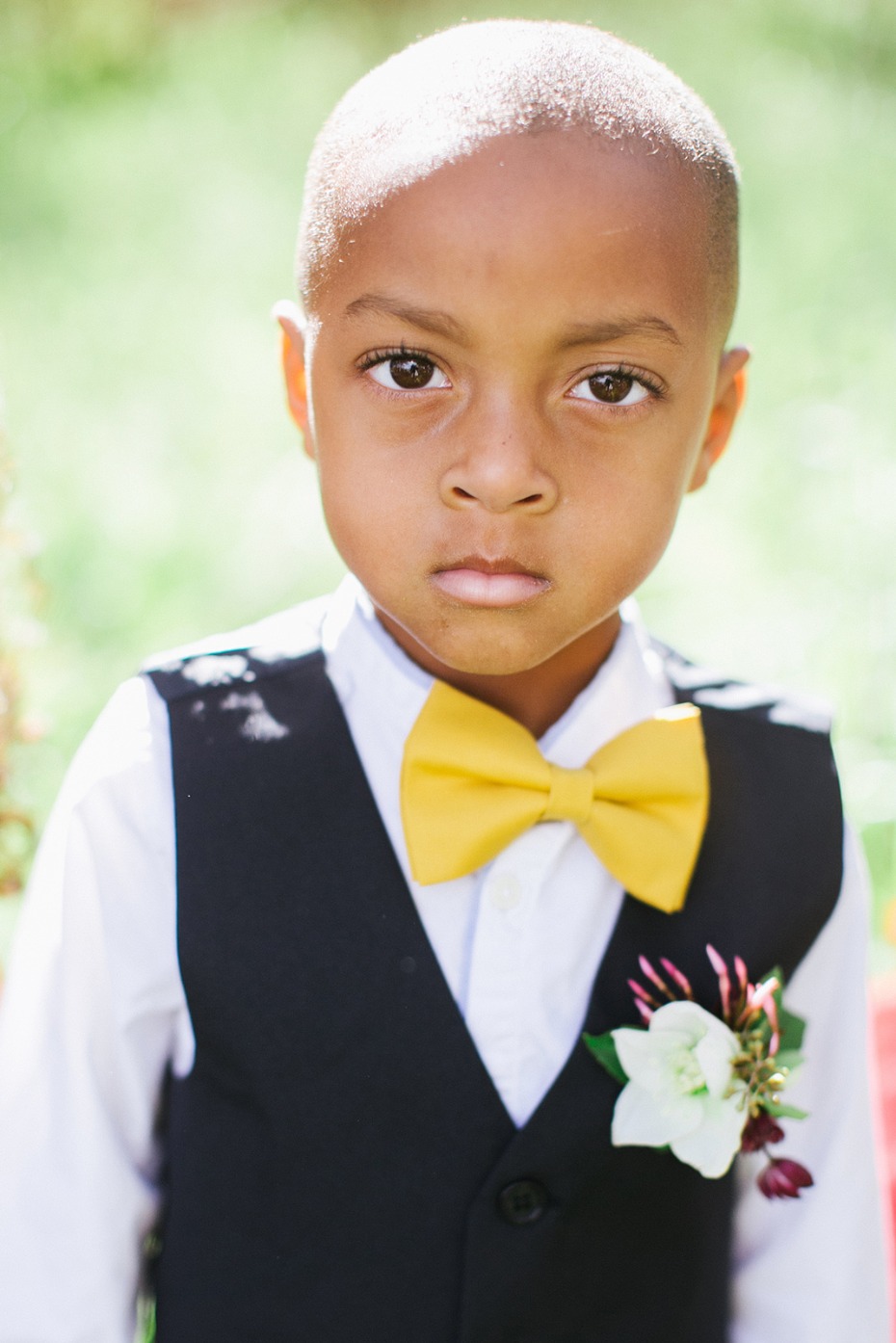 ring bearer in navy and yellow