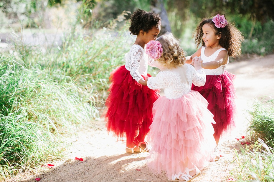a gaggle of flower girls in cute tulle dresses