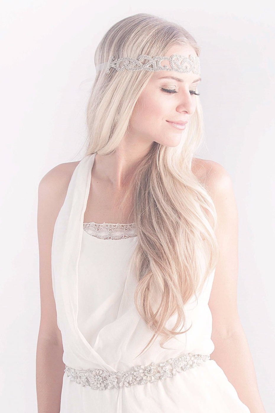 Woman with a sparkly headpiece and a flowing white dress
