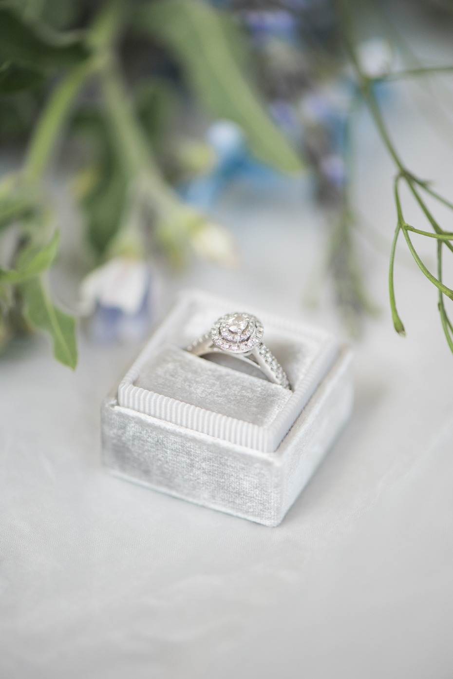 silver ring box with engagement ring