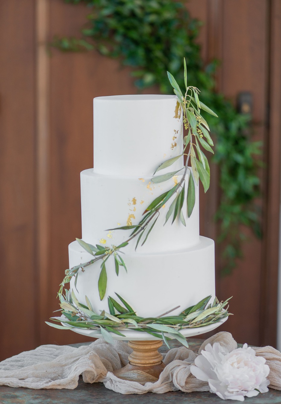 simple greenery accented wedding cake