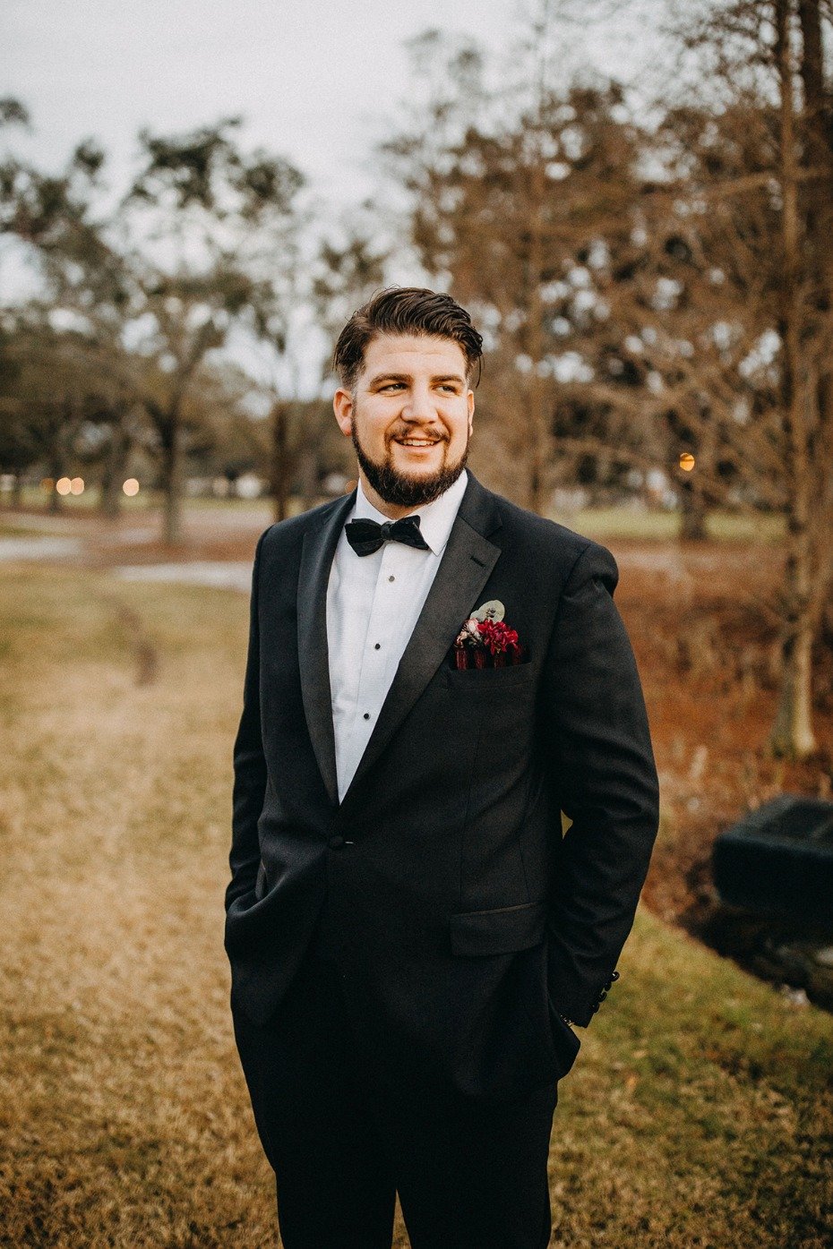 groom in classic black tie