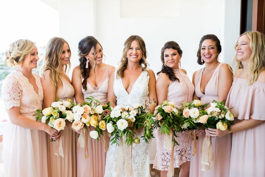 bride and her bridesmaids in soft pink