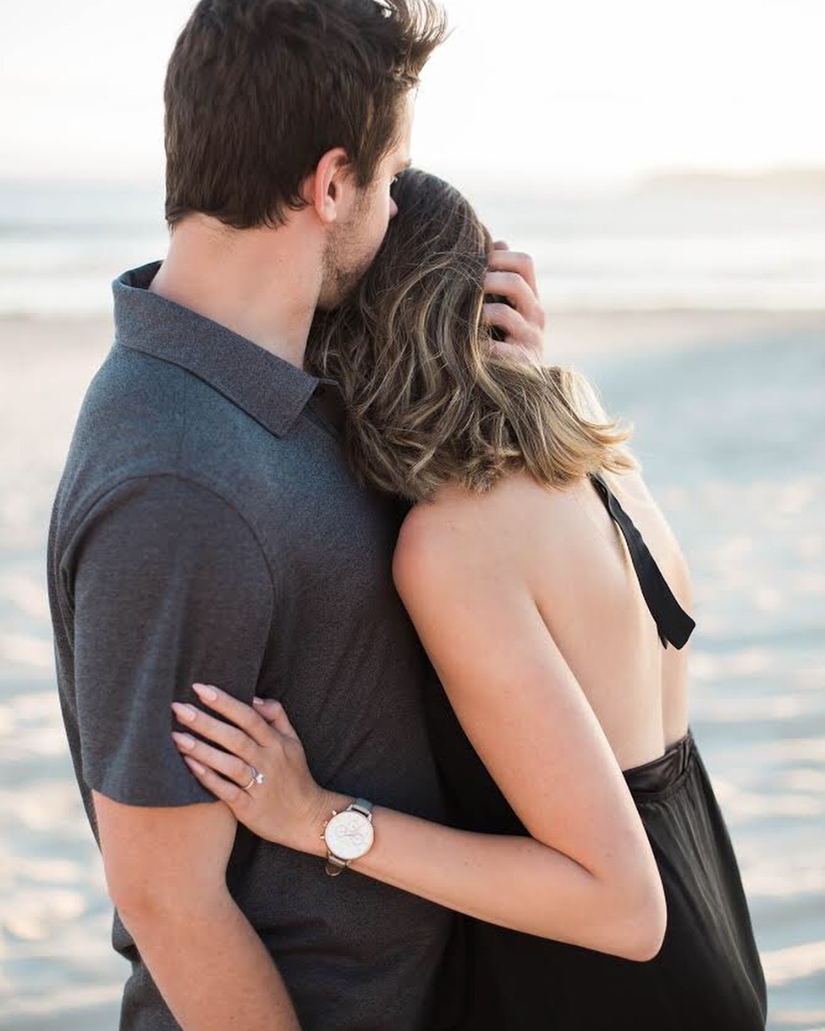 Couple just engaged on the beach; photo by Third Strand Photography