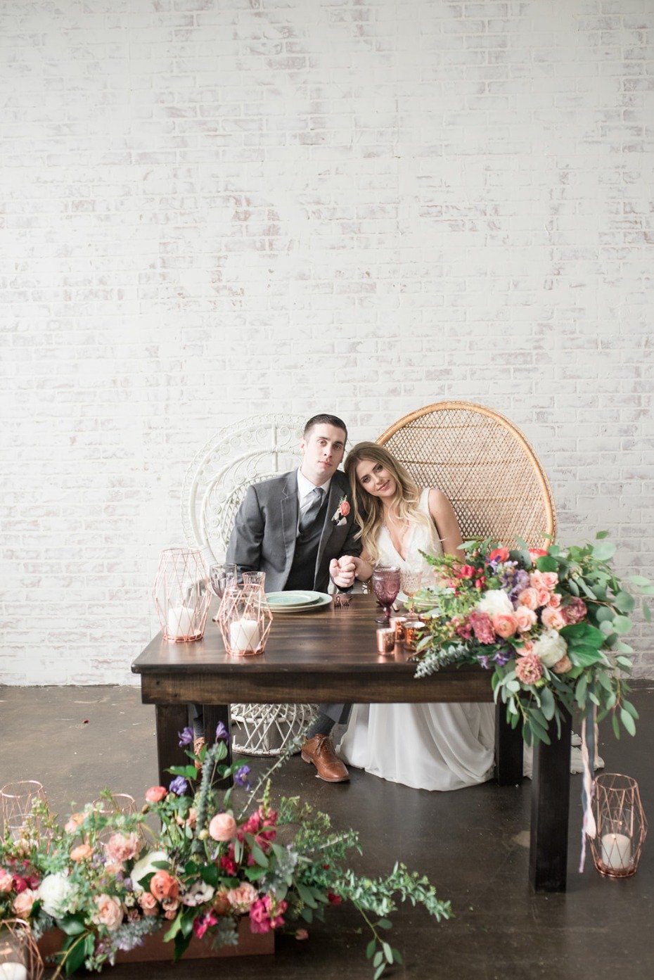 Bohemian sweetheart table with peacock chairs