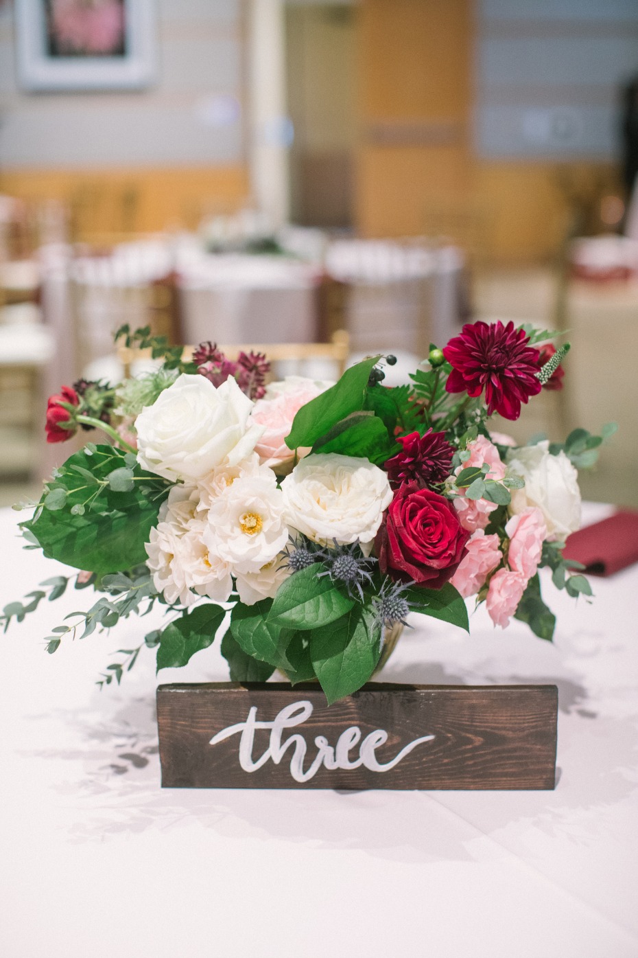 Floral centerpiece with wood table number