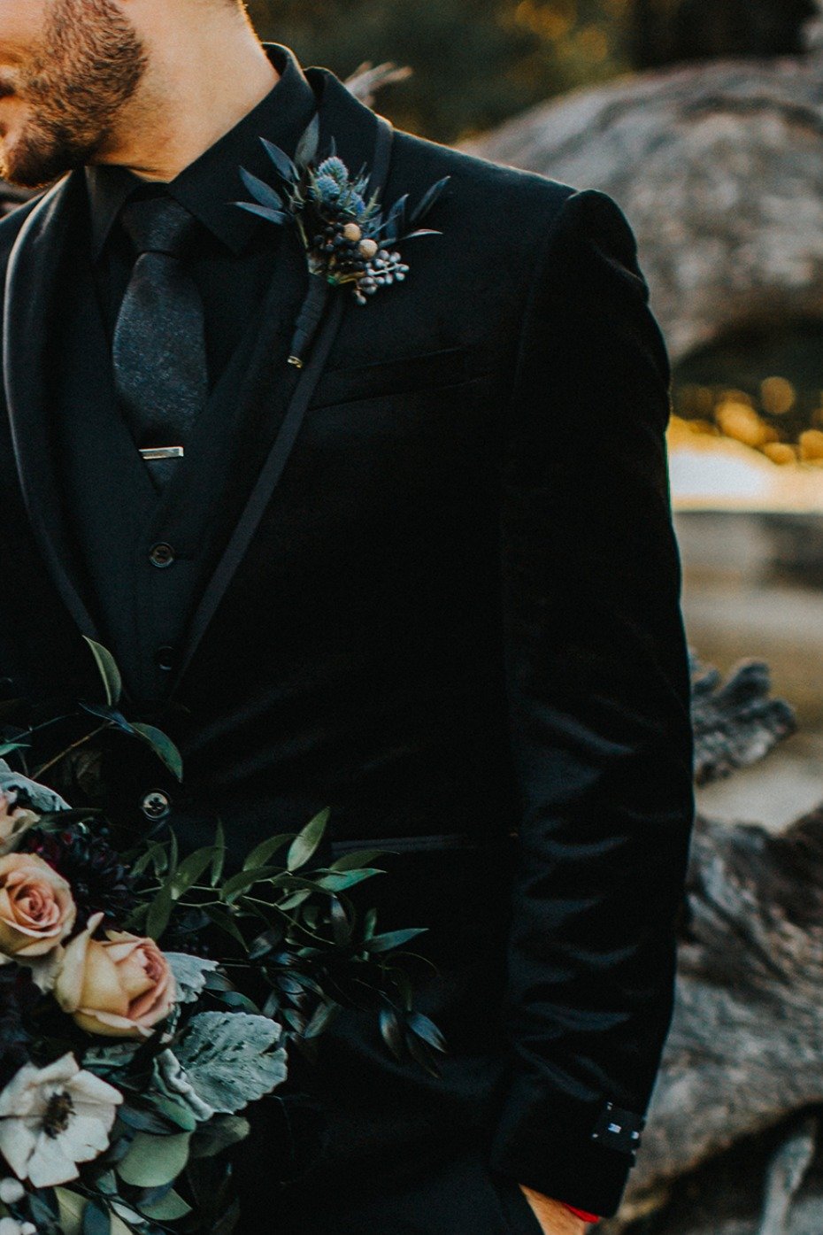 groom in black and velvet