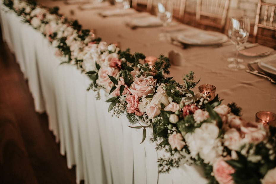 flower lined wedding party table