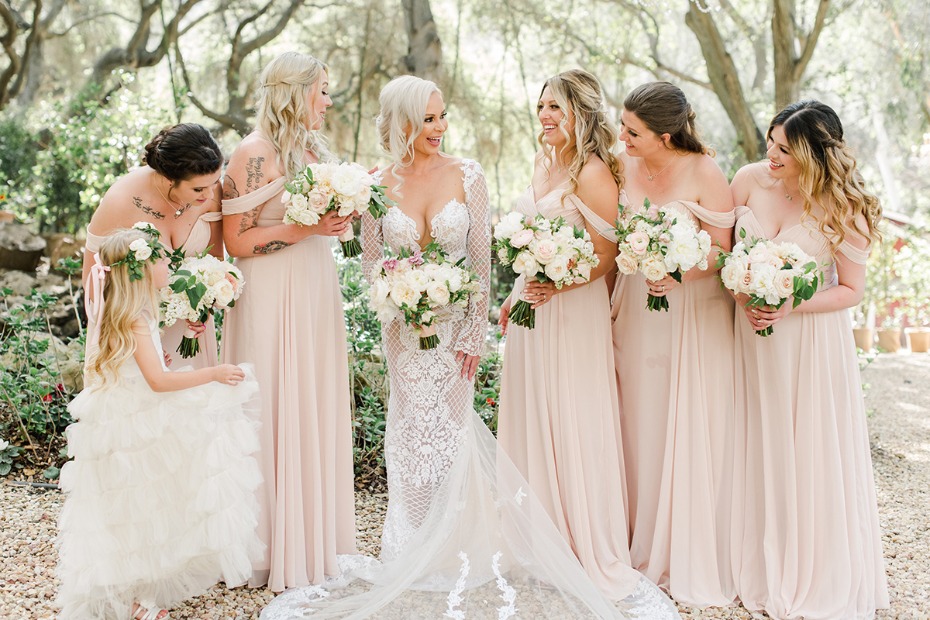 bride and her blush dressed bridesmaids