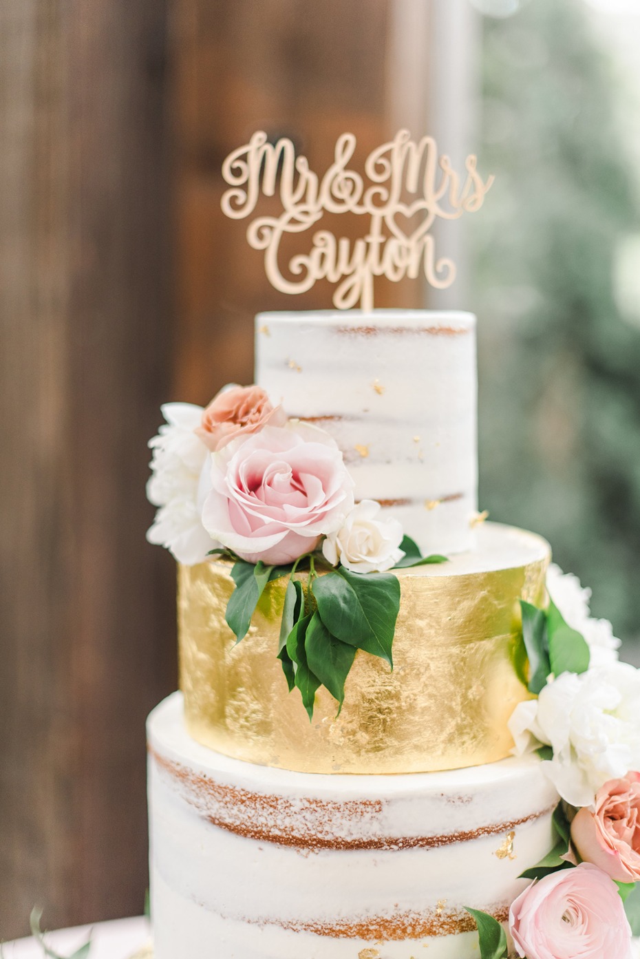 gold leaf nearly naked wedding cake