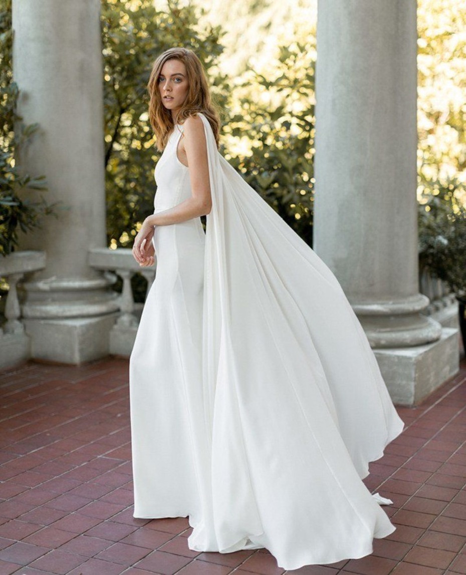 Get the look Kaley Cuoco caped wedding dress from Davie & Chiyo