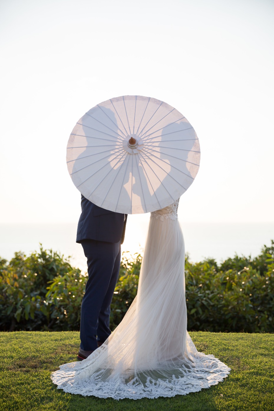 Cute parasol portrait for the bride and groom