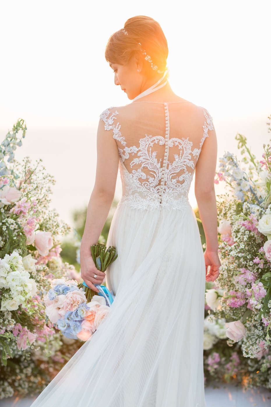 Elegant lace back wedding gown by Lusan Mandongus