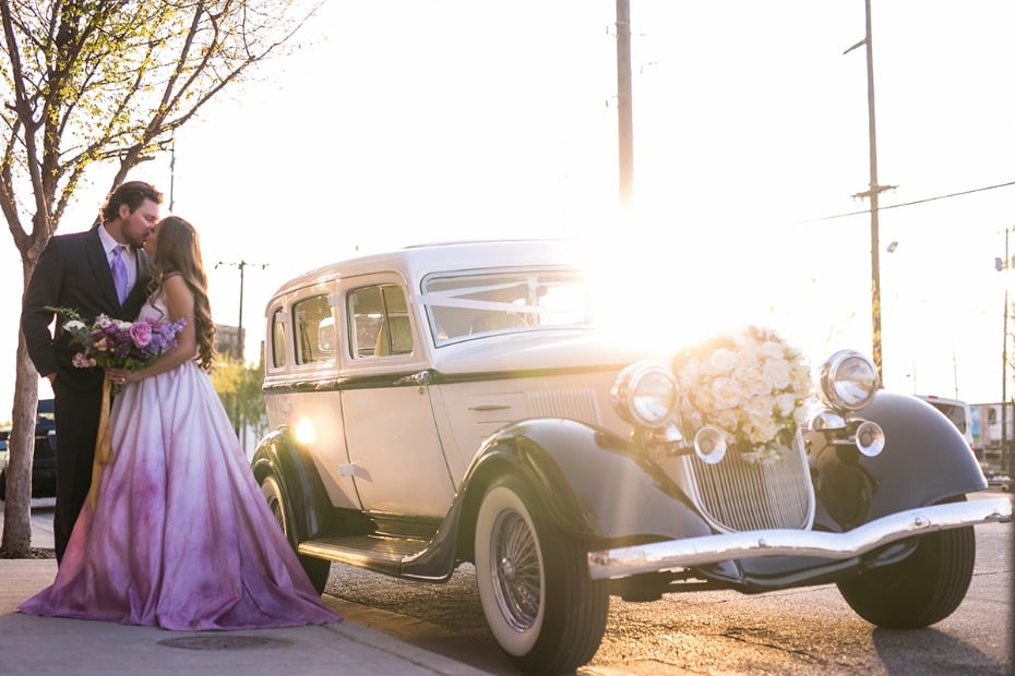 sunset wedding kiss and vintage transportation