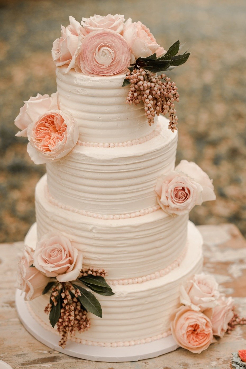 Gorgeous white wedding cake with flowers