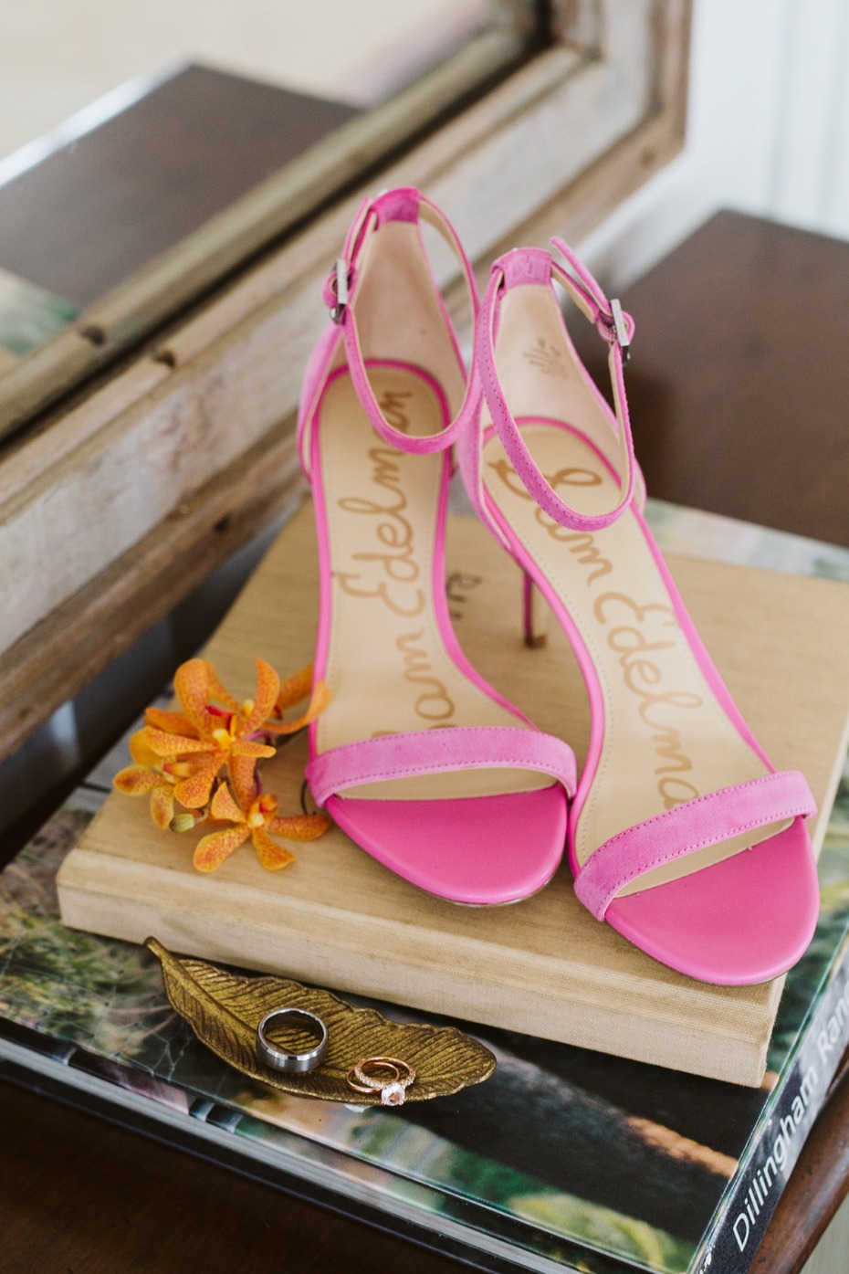 Pink Sam Edelman heels with wedding rings on a golden tray