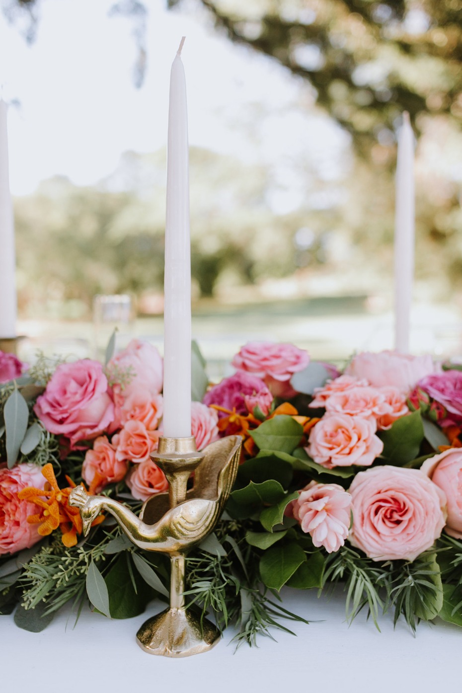 Elegant table centerpiece with flowers and bird candleholder