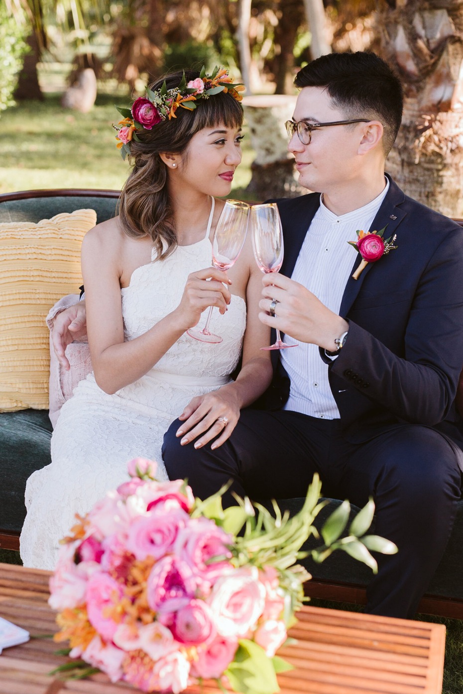 Newlyweds toasting with champagne at an outdoor wedding celebration