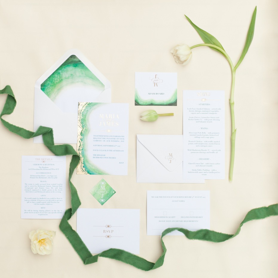 Elegant wedding invitations with watercolor and gold accents