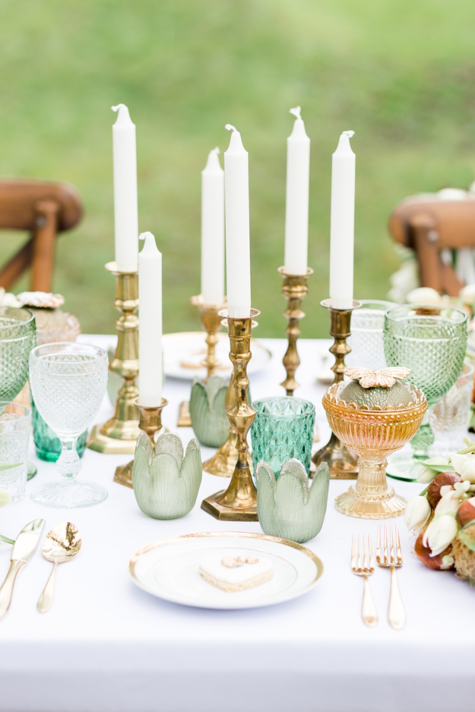 Brass candle sticks and colored glassware