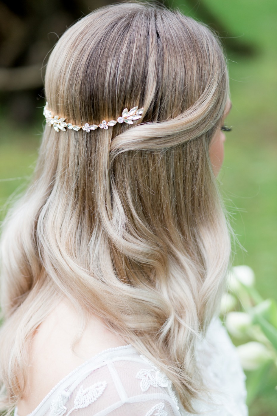 Elegant bride with a sparkling hair accessory and wavy blonde hair